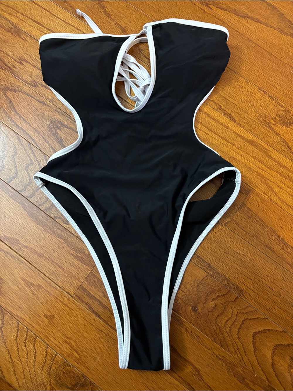 Black One-Piece Swimsuit with White Trim - Sleek Cutout Design
